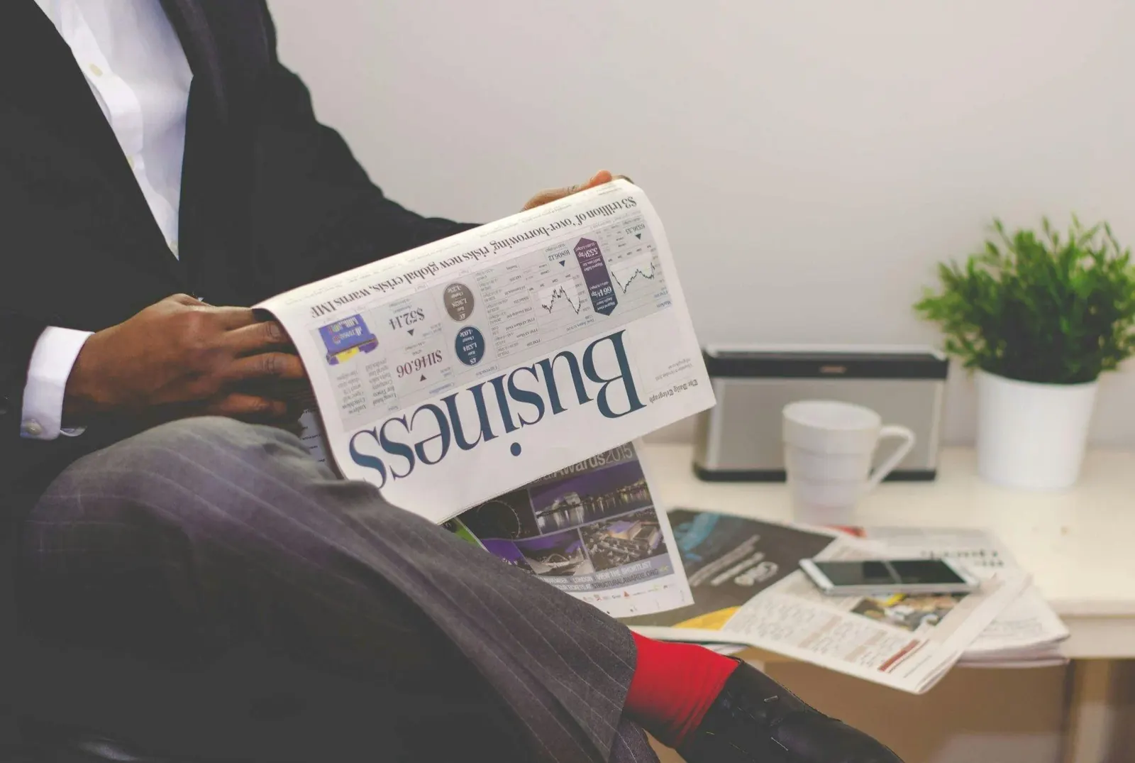 ADL Estate Planning: A financial newspaper on a desk